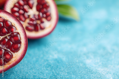 Halved fresh pomegranate revealing its juicy red seeds