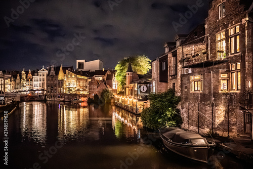 Illuminated Historic Buildings and Canalside View at Night in Ghent, Belgium