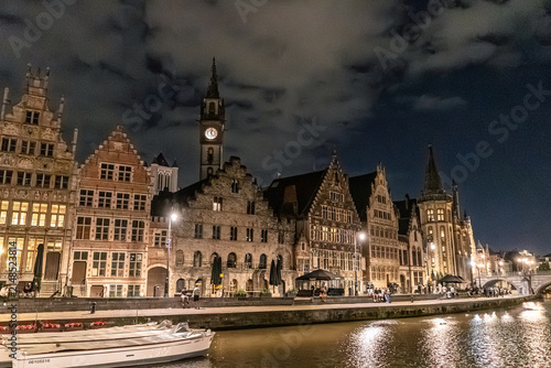 Illuminated Historic Guildhalls and Canal View at Night in Ghent, Belgium
