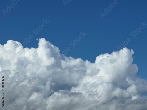 Fluffy cumulus clouds in blue sky