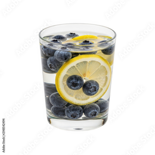 Fresh lemon and blueberries in iced water glass