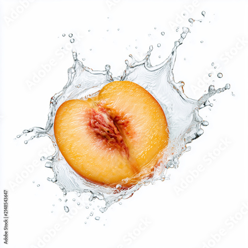 Fresh Peach Half Creating Crystal Clear Water Splash Isolated on White Background