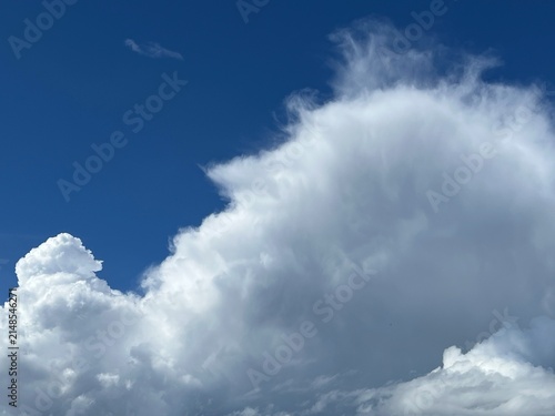 Cumulus clouds against blue sky