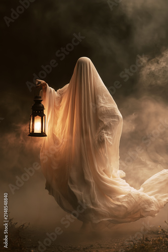 Ghostly Figure with Vintage Lantern Emerging from Mist, Creating a Haunting Ethereal Scene with Warm Golden Light and Mysterious Atmosphere. Copy space, aspect 2:3