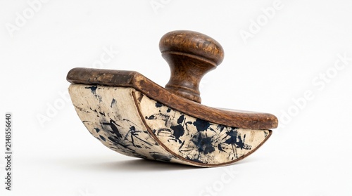 Antique wooden ink blotter with dark ink stains on white paper