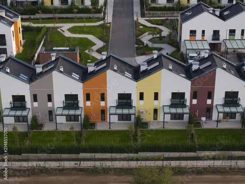 Aerial view of the modern Residential Park Lozen complex featuring colorful townhouses with gabled roofs, private gardens, and paved walkways in Sofia, Sofia City Province, Bulgaria.