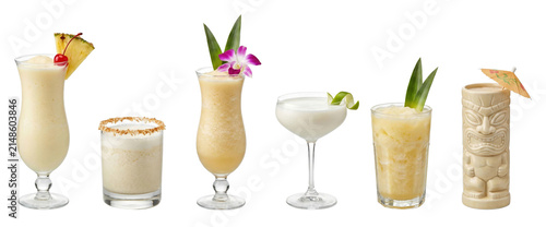 Collection of six assorted tropical cocktails including piña colada and frozen daiquiris served in various glasses and a tiki mug with exotic fruit and flower garnishes
