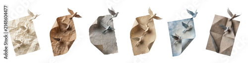 Collection of papercraft birds flying free from crumpled and aged paper sheets, illustrating a beautiful and delicate artistic concept of liberation and creativity