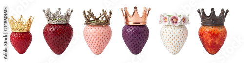 Collection of six colorful strawberries wearing ornate royal crowns and tiaras in gold, silver, and bronze, showcasing a whimsical and luxurious concept of regal fruit