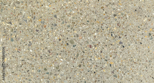 Exposed aggregate concrete surface with colorful small river stones and pebbles texture