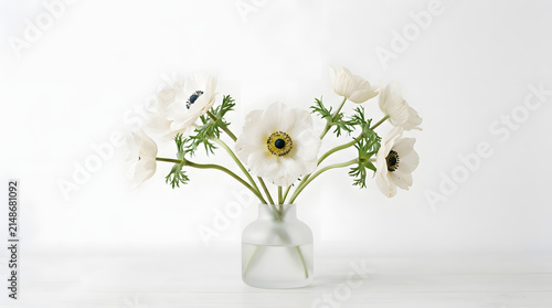 Elegant bouquet of white anemone flowers displayed in a clear glass vase