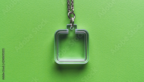 Minimal Square Pendant on Green Background Close Up.