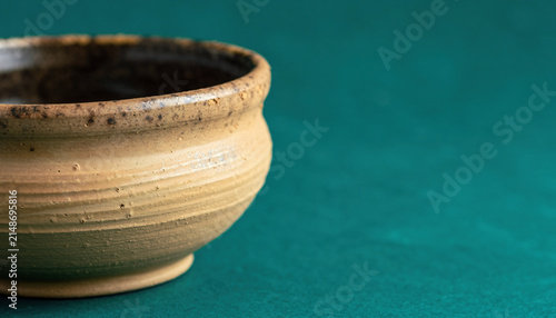 Minimal Ceramic Pot on Teal Background Still Life.