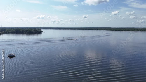 Boats cruising on a calm Summer day in the St Johns River near downtown Palatka in Putnam County, Florida. 