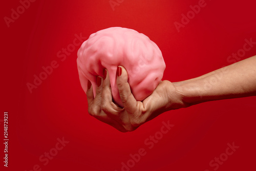 Human Brain Held in Hand Concept