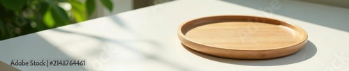 Minimalist wooden round trays on glossy white table, sunlit leaf shadows , modern, podium, health