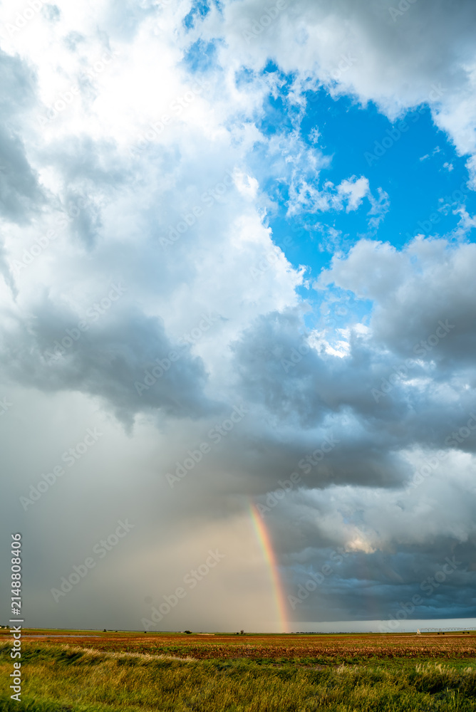 Obraz premium Rainbow After the Storm. Climate Change, Extreme Weather, Supercell Storms, Environmental Sustainability and Hope for a Changing Planet