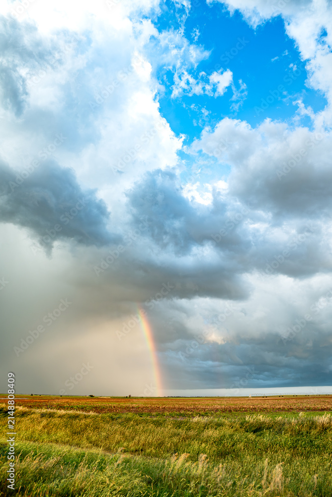 Obraz premium Rainbow After the Storm. Climate Change, Extreme Weather, Supercell Storms, Environmental Sustainability and Hope for a Changing Planet