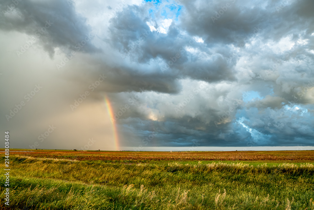 Obraz premium Rainbow After the Storm. Climate Change, Extreme Weather, Supercell Storms, Environmental Sustainability and Hope for a Changing Planet