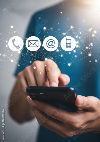 Businessman Using Smartphone with Digital Communication Icons for Contact Us and Customer Support Concept