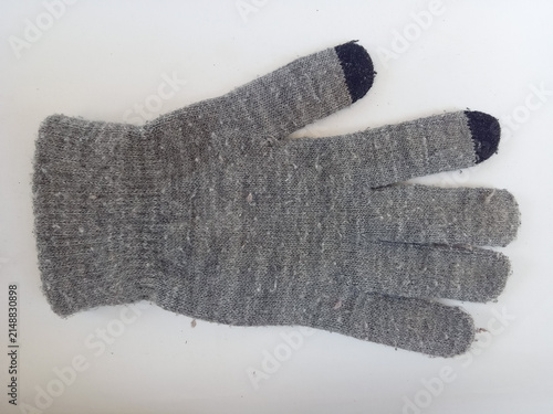 Принти на полотні Single gray knitted winter glove featuring black touchscreen compatible fingertips