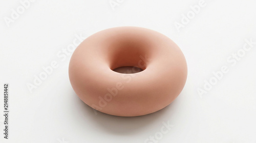 Notice the matte texture and soft shadow on this squishy donut shaped object on white