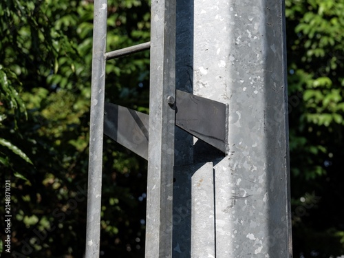 Canvas Print Heavy duty utility tower post with access ladder attached by steel brackets in an outdoor setting