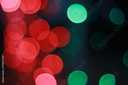Canvas Print Blurred circular lights in red, pink, and green, out of focus glowing orbs on a