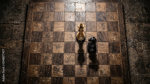 Obraz na plátně An intense psychological bird's eye view of a scarred antique wooden chessboard