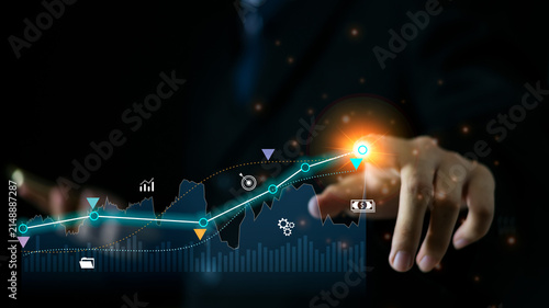 Business professional analyzing global financial data with AI-powered analytics. Interactive dashboard, business growth, investment insights, and data-driven decision making concept.