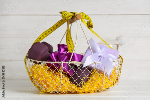 Basket with purple dumbbell...