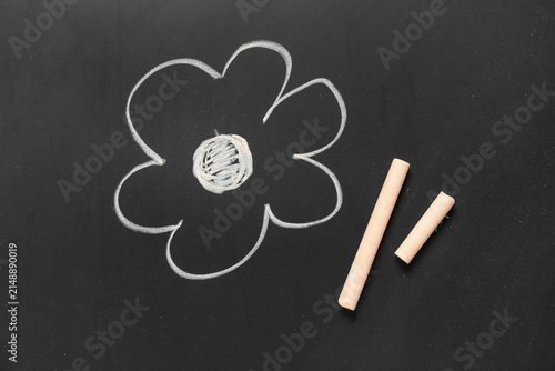 Orange chalks with drawn fl...