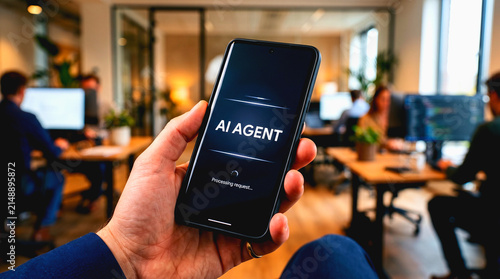 Person holding a smartphone with AI agent interface in a modern office