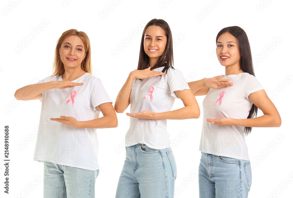 Obraz premium Beautiful women with awareness pink ribbons on white background. Breast cancer concept