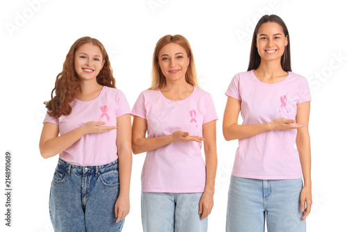 Beautiful women with awareness pink ribbons on white background. Breast cance...