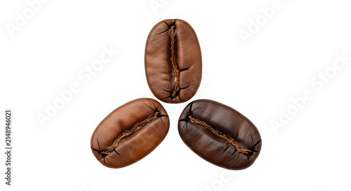 Three roasted organic coffee beans arranged in a small triangular group isolated on transparent background
