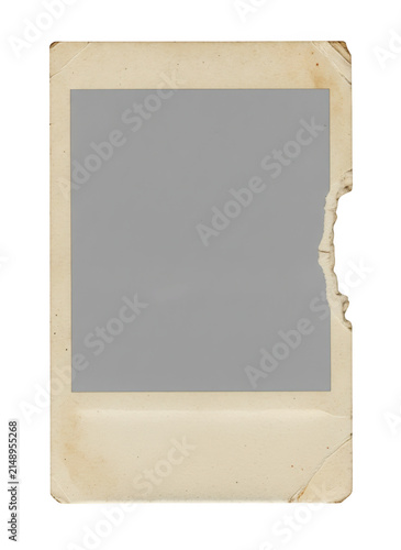 Old vintage polaroid photo frame with torn edge and paper texture