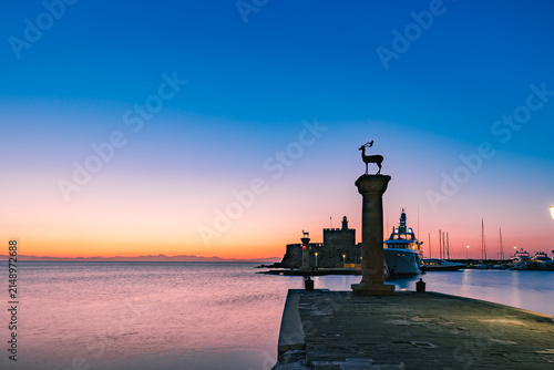 Konstfotografi Scenic morning view of the entrance to Mandraki Harbour in Rhodes Town, Greece—traditionally believed to be the site of the ancient Colossus of Rhodes