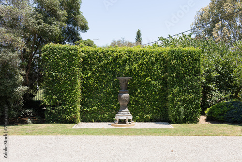 A large cast iron decorative vase stands in the Bahai Gardens near Acre city in northern Israel.