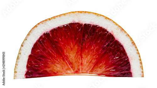 Фотография Blood orange slice with vibrant red flesh and white pith