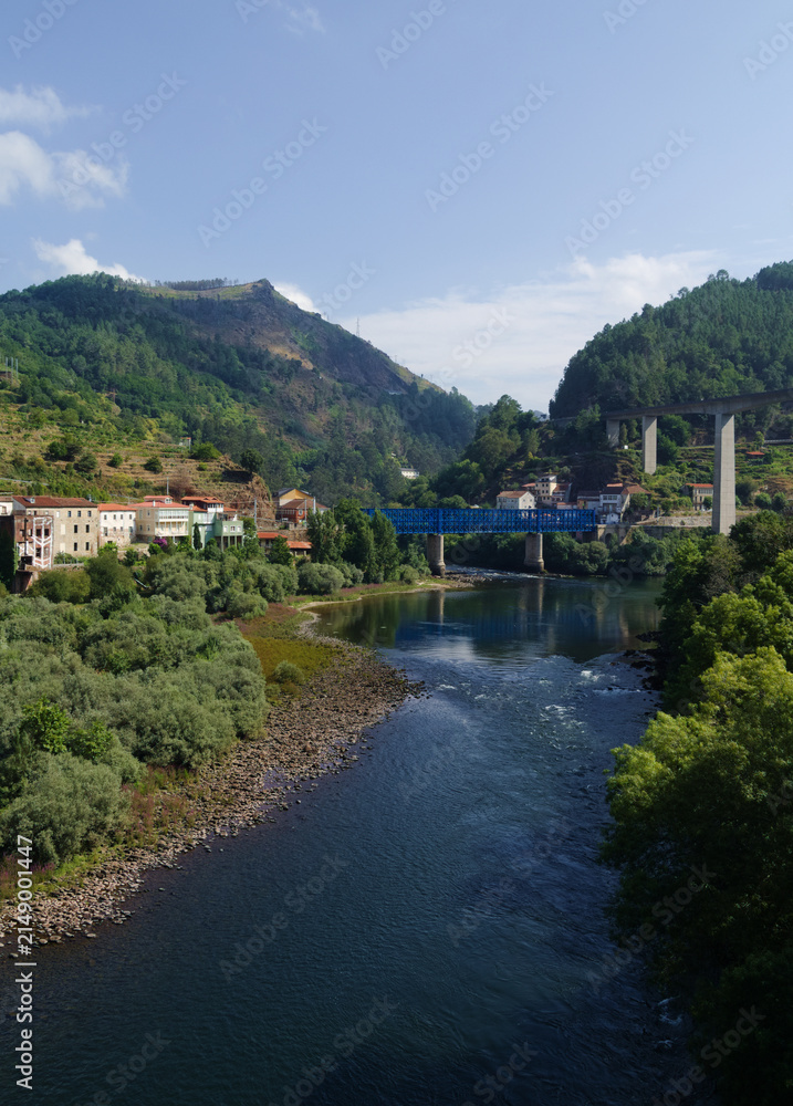 Fototapeta premium Summer view of depopulated Os Peares village in Galicia, Spain, representative of 