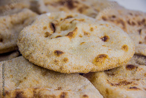 Egyptian baladi Bread Food Photography, breakfast, lunch, dinner,  traditional whole wheat flatbread known for its hearty texture and nutty flavor, selective focus, shallow depth of field, Cairo Egypt
