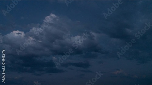 Timelapse: blue clouds in summer twilight sky