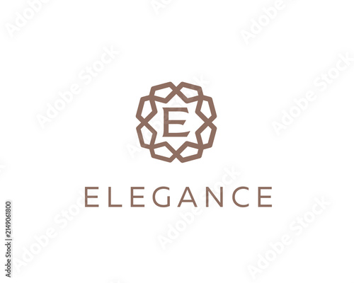 Luxury letter E ornament logo design. Elegant gold geometric initial logotype. Premium emblem for hotel, beauty, fashion and wealth management brands.