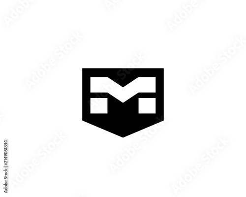 Geometric letter M shield logo design. Minimal black coat of arms initial logotype. Modern icon for security, law, finance and business development brands.