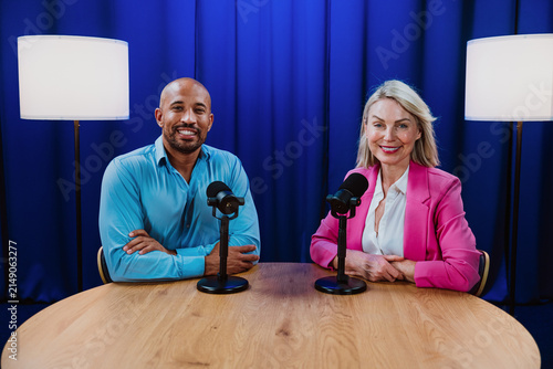 фотографія Hosts recording podcast episode in broadcast studio