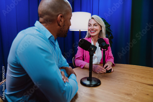 фотографія Hosts recording podcast episode in broadcast studio