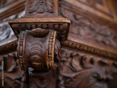 Close up of a carved oak corbel with egg and dart and foliate ornament in a historic church, woodwork craftsmanship and heritage detail.