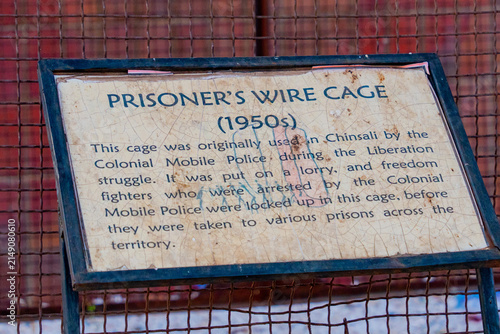Lusaka, Zambia - 01 July 2026: View of the Prisoner's Wire Cage, a historical artifact used by the Colonial Mobile Police during the liberation struggle, displayed with descriptive signage.