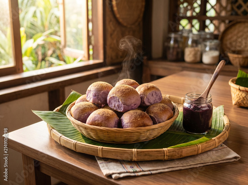 Freshly baked purple yam bread rolls on a tray